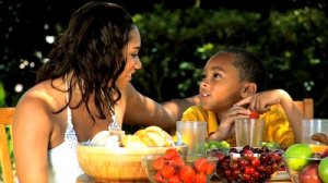 stock-footage-young-ethnic-mother-son-healthy-eating-lunch